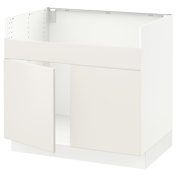 White SEKTION kitchen cabinet with smooth design and handle-less doors.