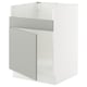 Modern white and grey kitchen cabinet with one visible door and a sleek, minimalist design.