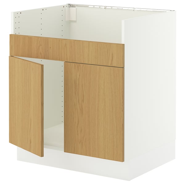 This image shows an ikea SEKTION kitchen cabinet in white with light oak doors and drawers. It has a sleek, modern design.