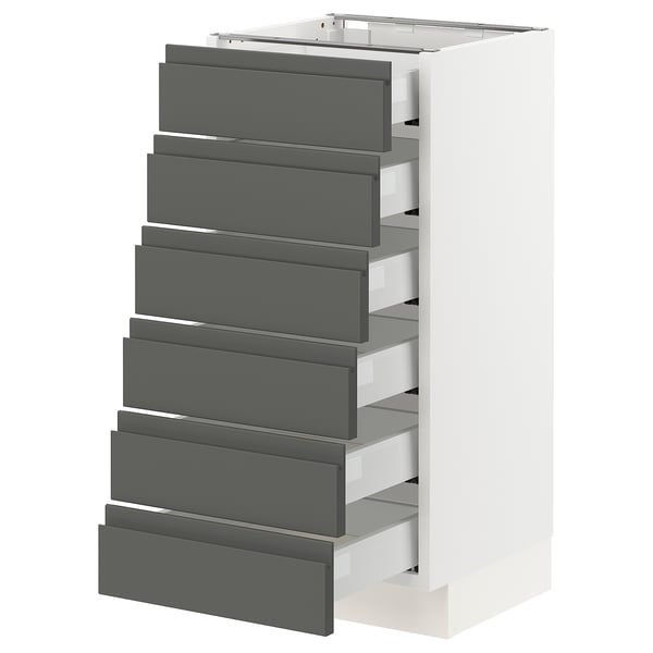 The SEKTION kitchen cabinet in white with dark grey drawers. Modern design, six drawers, smooth and sturdy build.