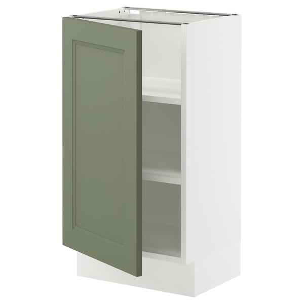 A white SEKTION kitchen cabinet with a green axstad door, featuring adjustable shelves and a hinge with a door damper.