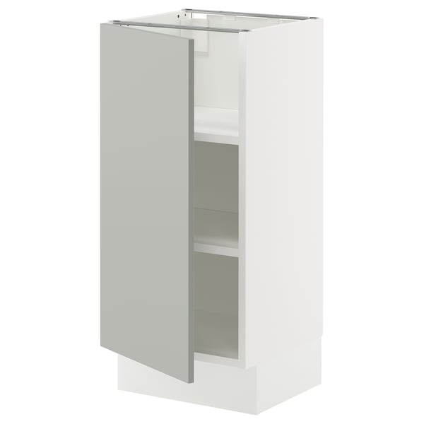 Modern light grey SEKTION kitchen cabinet with adjustable shelves, white details, and a three-dimensional square shape.
