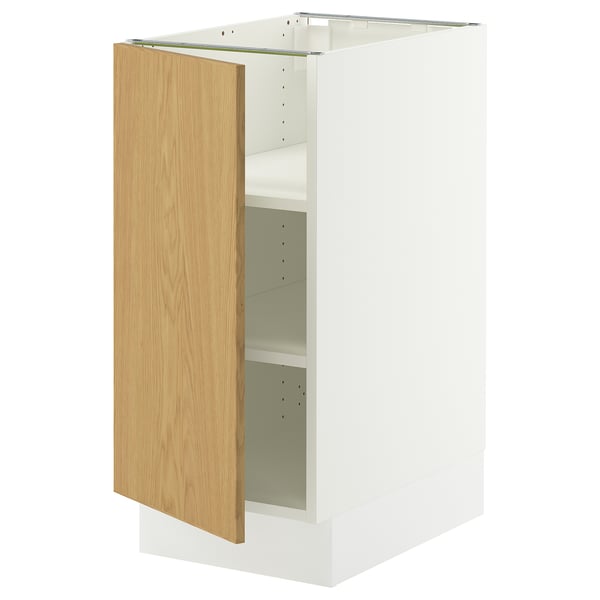 An ikea SEKTION cabinet with a white frame and a light wooden door, partially open.