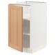 SEKTION kitchen cabinet in white and light wood, open door, adjustable shelves. Modern, minimalist design with sturdy frame.