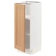 A SEKTION kitchen cabinet with a light oak door and white body, featuring an open design for storage.