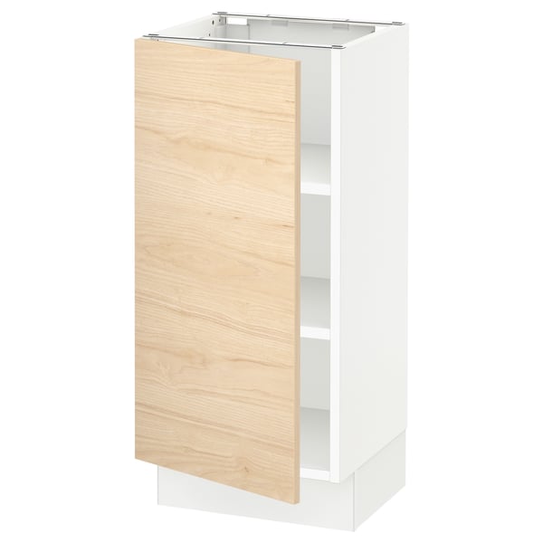 A SEKTION kitchen cabinet with a light wood door and white base. The modern design offers adjustable shelves.