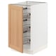 SEKTION kitchen cabinet with oak door and metal shelves.