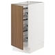 A modern white kitchen cabinet with a walnut door, wire storage shelves, and soft-closing hinges.