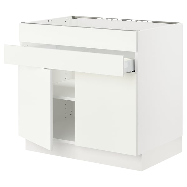 White SEKTION kitchen cabinet, modern design with adjustable shelves and damper hinges.