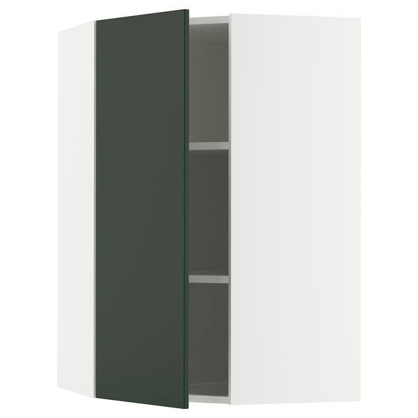 SEKTION kitchen cabinet in deep green with open door, white frame, and dark interior shelves.