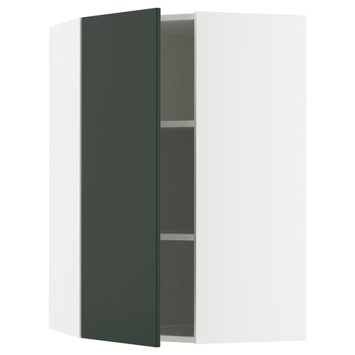 SEKTION kitchen cabinet in deep green with open door, white frame, and dark interior shelves.