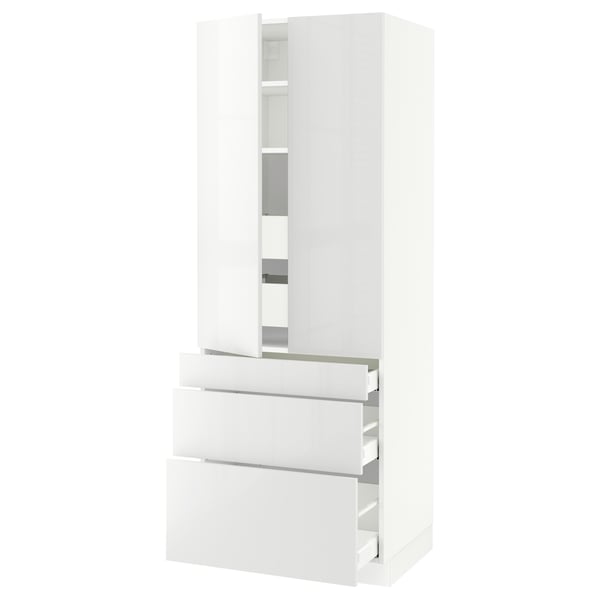 Sleek white SEKTION kitchen cabinet with glossy doors, adjustable shelves, and soft-close drawers.