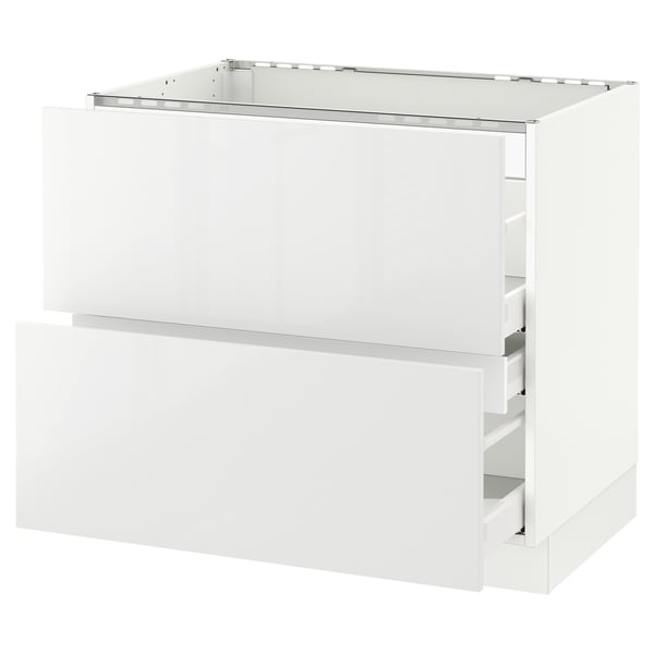 White kitchen cabinet, sleek design, glossy finish, rectangular shape, with two open drawers, part of ikea SEKTION system.