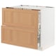 SEKTION kitchen unit with oak drawers and white base, modern design.