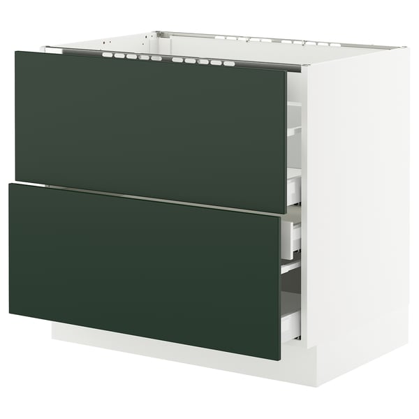 A modern kitchen cabinet system named SEKTION with dark green drawers. It has a sleek, rectangular design and uses durable materials.