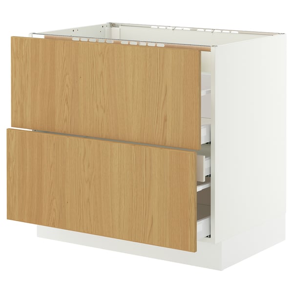 A SEKTION kitchen cabinet with oak-veneer drawers and a white base.