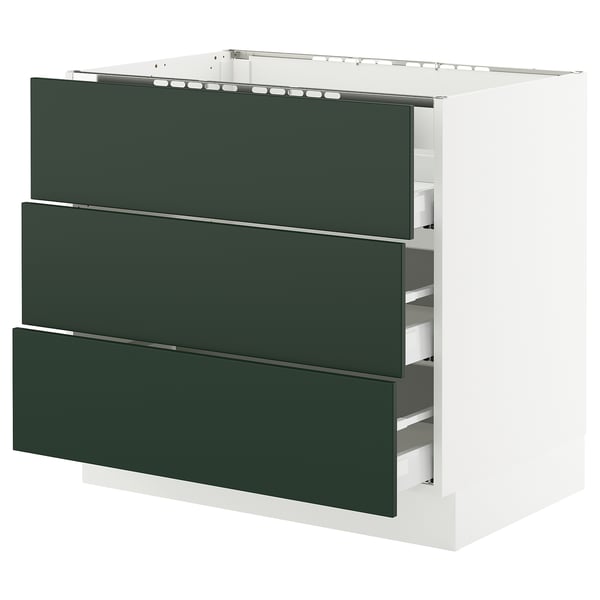 A modern kitchen cabinet named SEKTION with three green drawers, a white base, and sleek design.