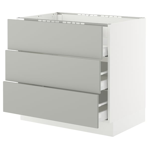 Ikea SEKTION white kitchen cabinet, light grey drawers, rectangular shape, modern clean design.