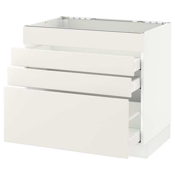 A white ikea SEKTION kitchen cabinet with three drawers and an open shelf at the top.