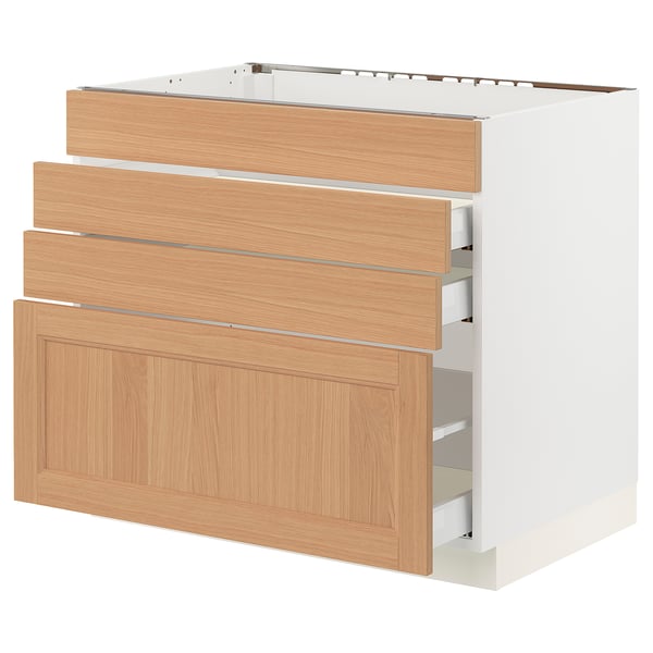 SEKTION kitchen unit with oak drawers and white base.