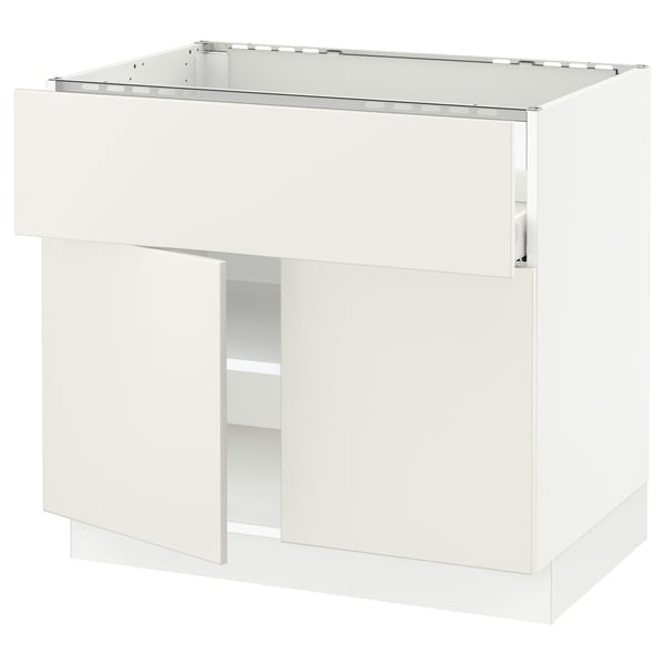 White SEKTION kitchen cabinet with veddinge fronts, smooth lines, and adjustable shelves.