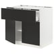 SEKTION kitchen unit in matt black and white, modern design with open section, made of particleboard and steel.