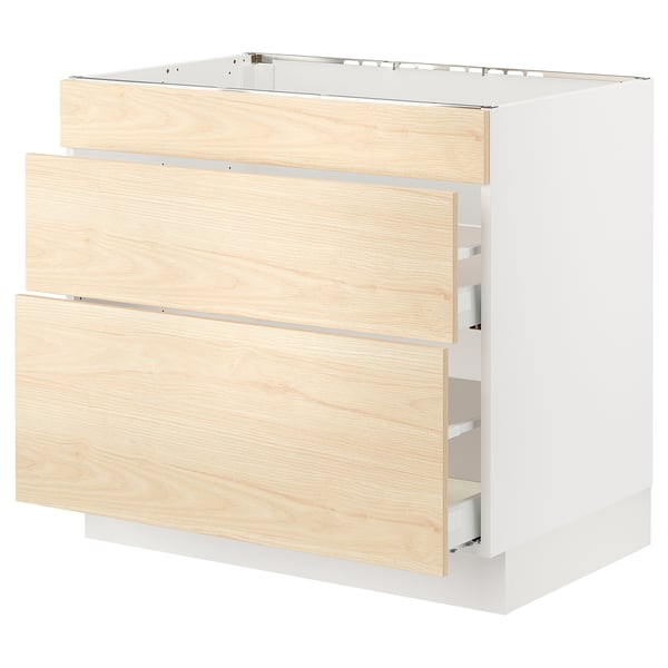 Light wood-toned kitchen cabinet with two visible drawers, featuring a white frame and sleek, modern design.