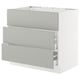 A white SEKTION kitchen cabinet with three light grey drawers. It has a modern, clean design with a smooth finish.
