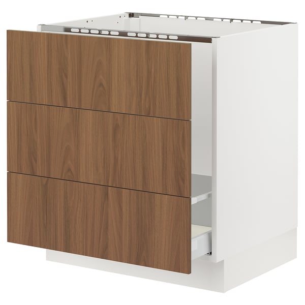 Modern white kitchen unit with walnut brown drawers, smooth surface, three drawers.