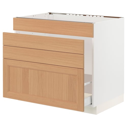 An ikea SEKTION kitchen cabinet in white with oak drawers and shelves. It has a sleek, modern design with tons of storage space.