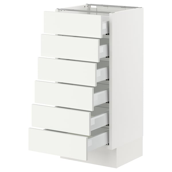 White SEKTION kitchen cabinet with six drawers, sleek modern design.