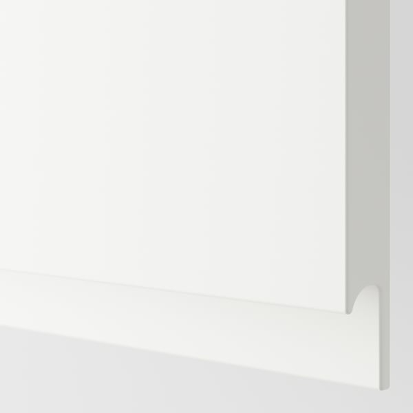Matte white kitchen cabinet with sleek handle-free design, showcasing modern, minimalist craftsmanship.