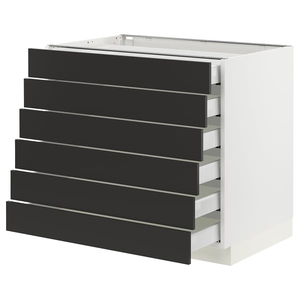 Modern kitchen unit, white and black, six drawers, minimalist design.