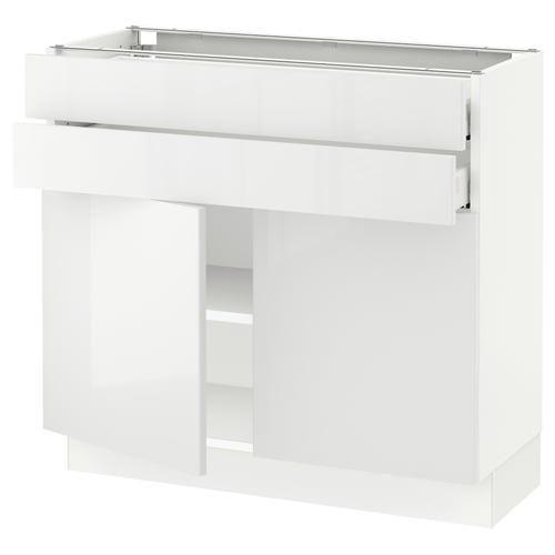 White modern kitchen cabinet with drawers and shelves.