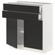 Modern kitchen cabinet in black and white, featuring sleek design with two drawers and one open shelf, made of recycled plastic and particle board.