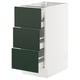 White SEKTION kitchen cabinet with green drawers.