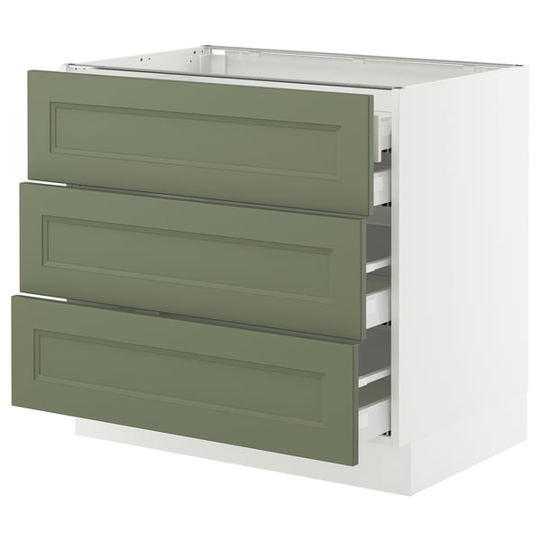 An olive green three-drawer cabinet with a white base, part of IKEAs SEKTION kitchen system.