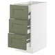A white IKEA SEKTION kitchen cabinet with three green drawers. The drawers are flat-fronted with gray-green colour and have a smooth, modern design.