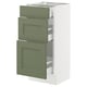An ikea SEKTION kitchen cabinet with grey-green axstad fronts, including drawers and shelves, set against a white frame.