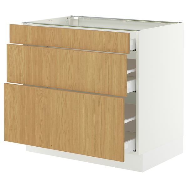 A SEKTION kitchen cabinet in white with three light oak drawers. It a sturdy frame and smooth-running drawers with soft-close mechanisms.
