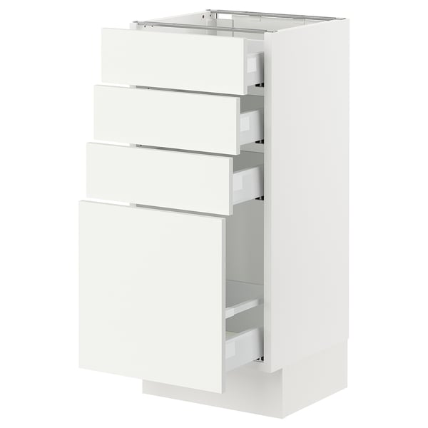 White SEKTION kitchen cabinet with multiple drawers, sleek modern design.