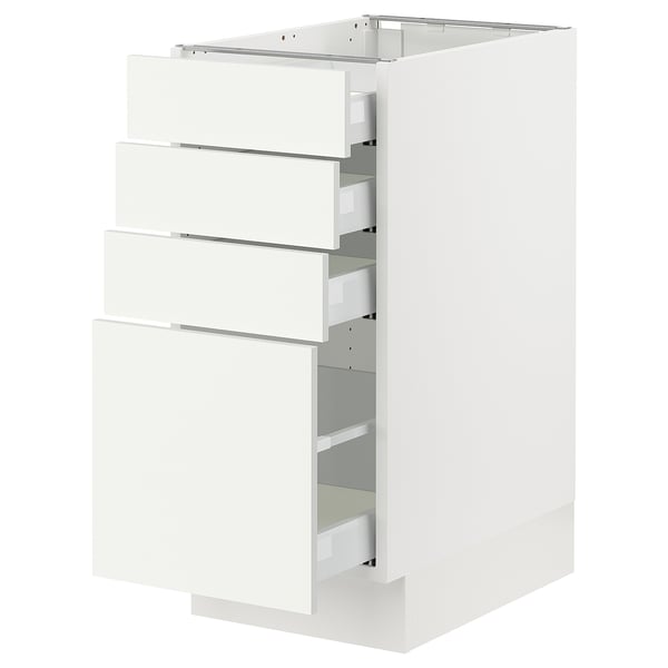 A white SEKTION kitchen cabinet with multiple drawers. It a sleek, modern design with smooth surfaces and metallic drawer handles.