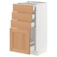 An ikea SEKTION kitchen cabinet with white and oak drawers, modern design.