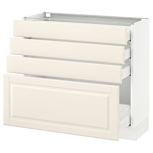 A white SEKTION kitchen cabinet with three drawers and a pull-out tray. It a classic, off-white design with bevelled edges.