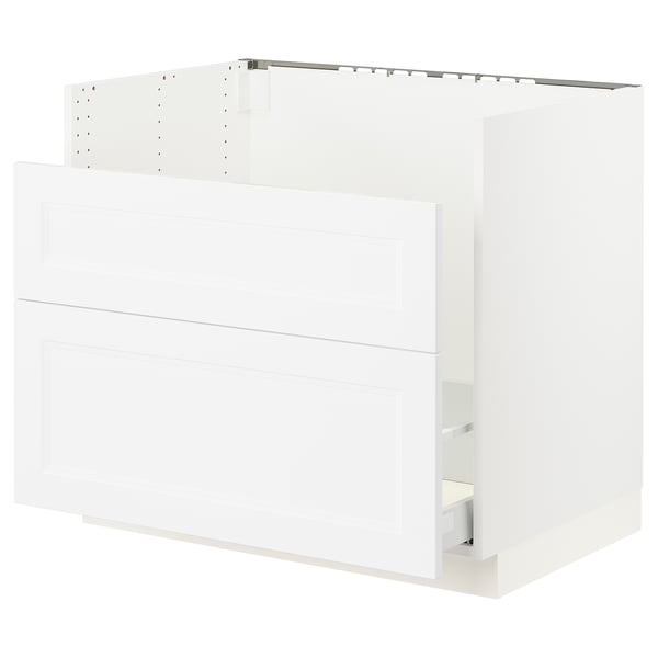 A white SEKTION kitchen cabinet with smooth, glossy doors and a drawer. It a modern, clean design and is made from particleboard and fiberboard.