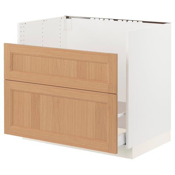 White kitchen cabinet with oak drawers.