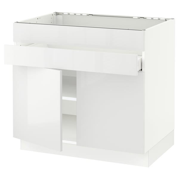Modern white gloss kitchen cabinet with sleek design and adjustable shelves.