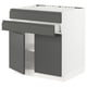 An assembled modular kitchen unit named SEKTION with dark grey handles and a white frame.