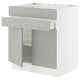 SEKTION kitchen cabinet in light grey with adjustable shelves.