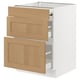 An ikea SEKTION kitchen base cabinet with three wooden drawers in a light oak finish.